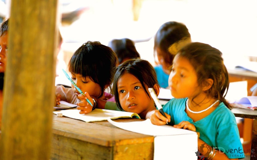 EDGE Worldwide Cambodia educational charity — Phum Ou school and vocational training centre Students learning in the open-air classroom at Phum Ou, built by EDGE Worldwide, a Cambodia educational charity in Siem Reap