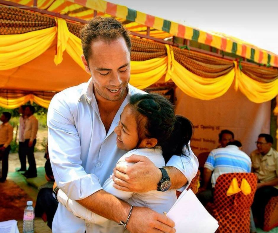 A student embracing Jamie Christopherson at the official opening of the Phum Ou vocational training centre