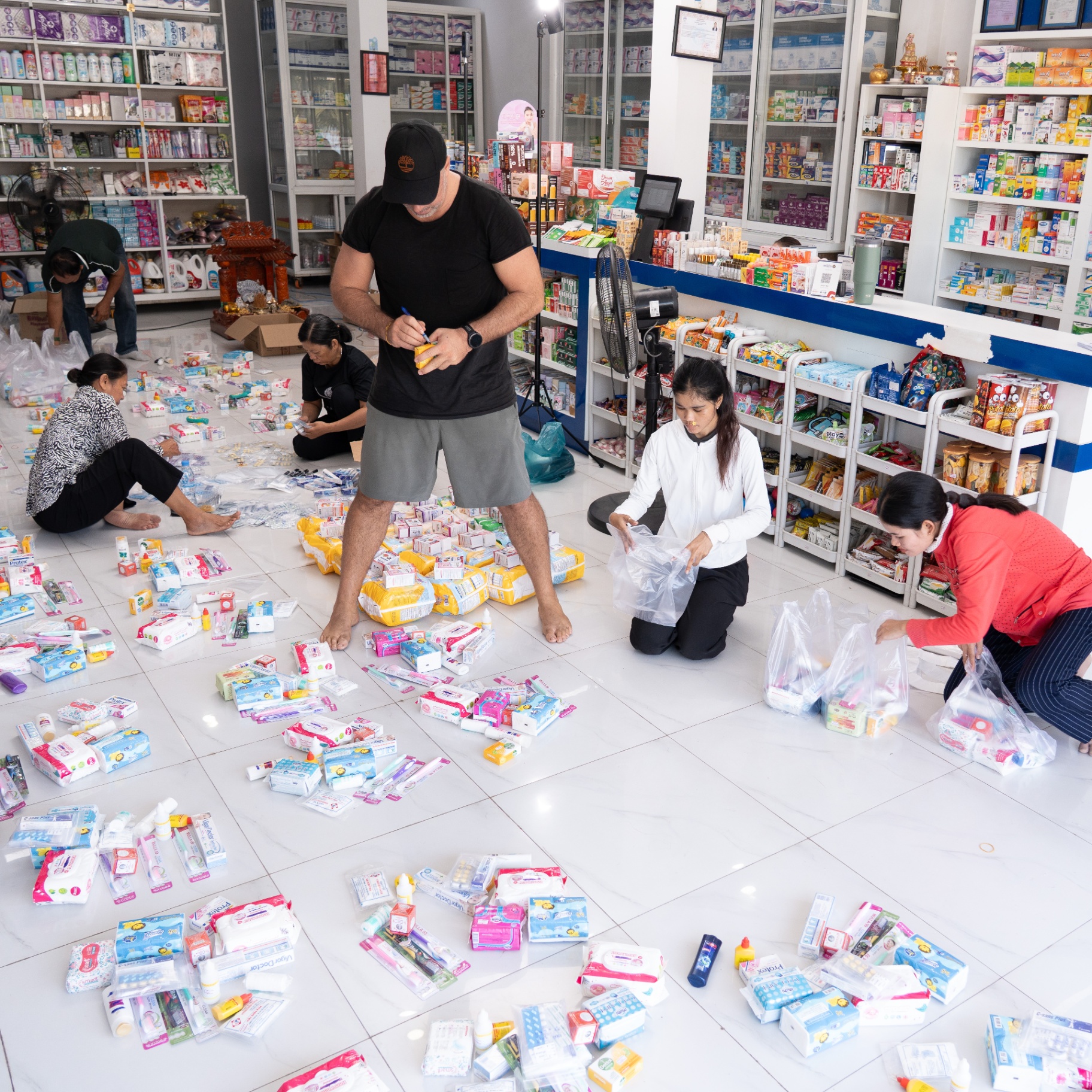 EDGE Worldwide turns a pharmacy into a sorting station for Cambodia border crisis relief supplies