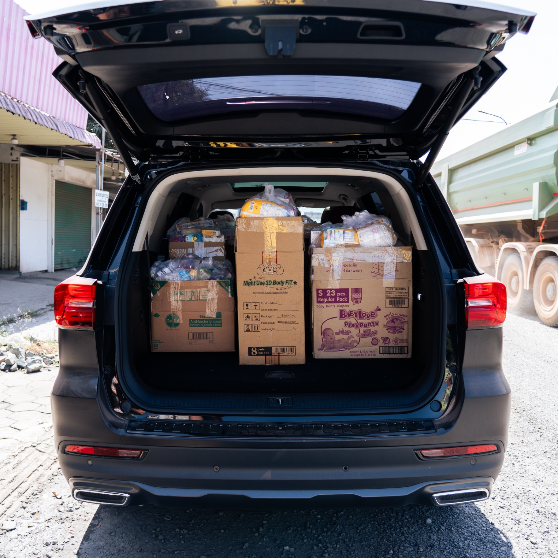 A vehicle loaded with EDGE Worldwide medicine and relief supplies departs for Cambodia border displacement shelters