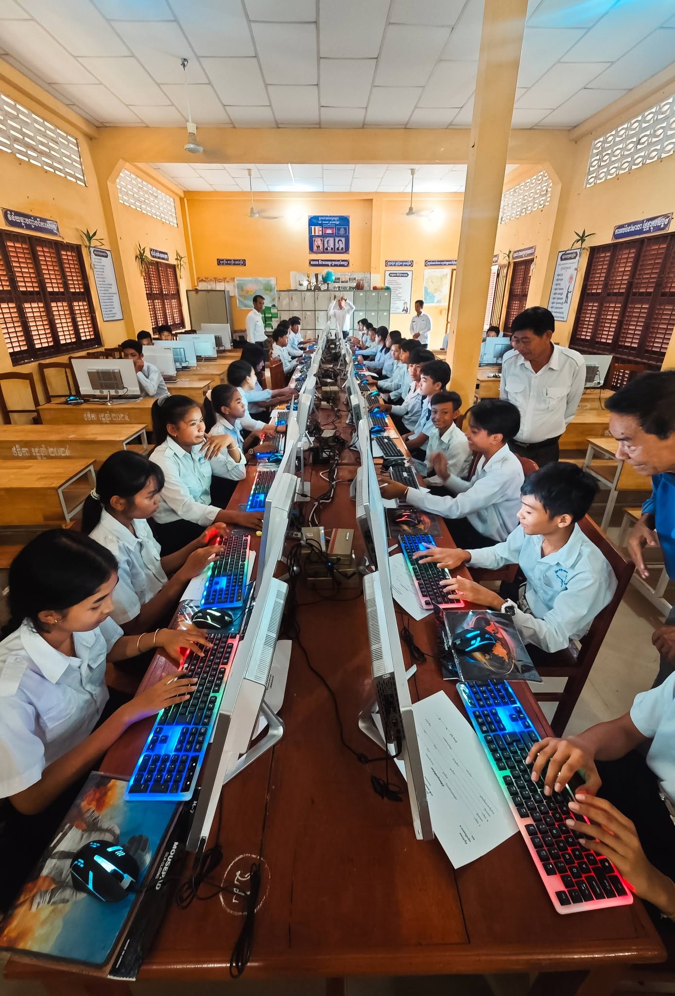 Rows of students using computers in the new IT lab