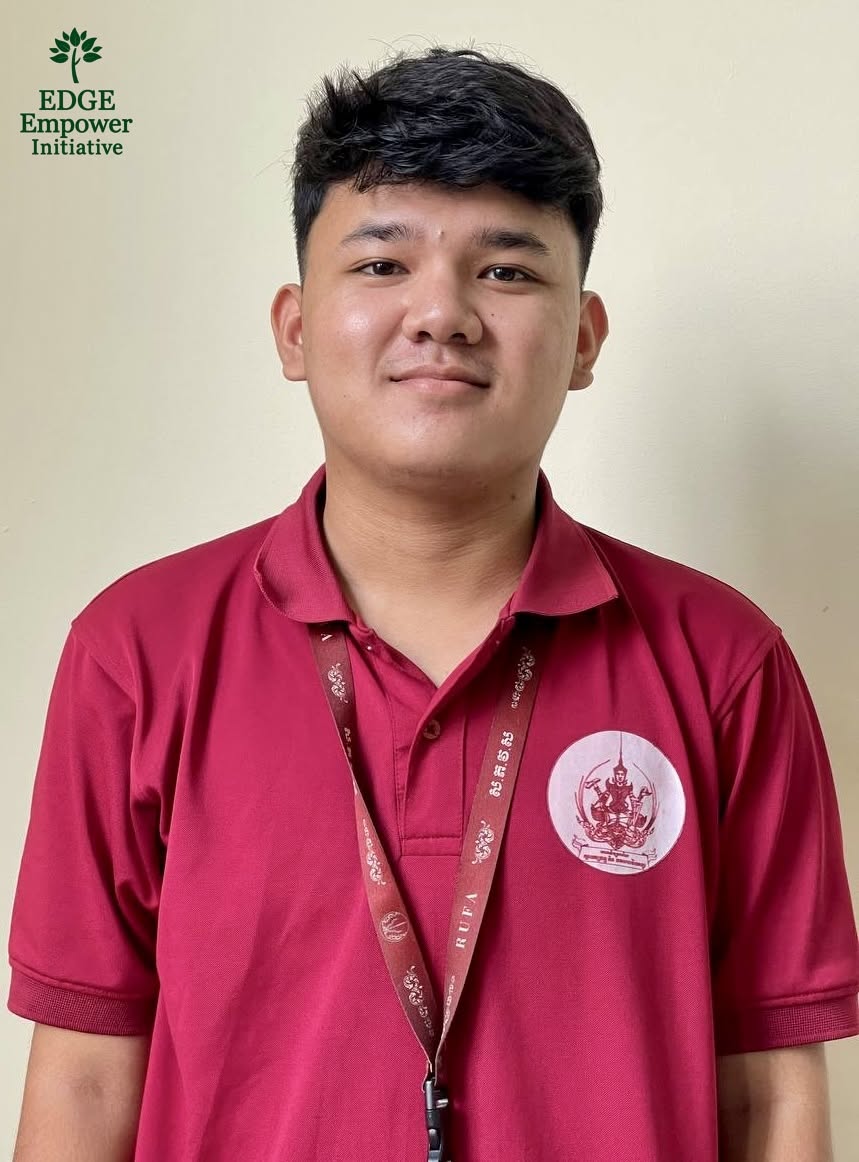 Mony wearing a red university polo shirt and lanyard